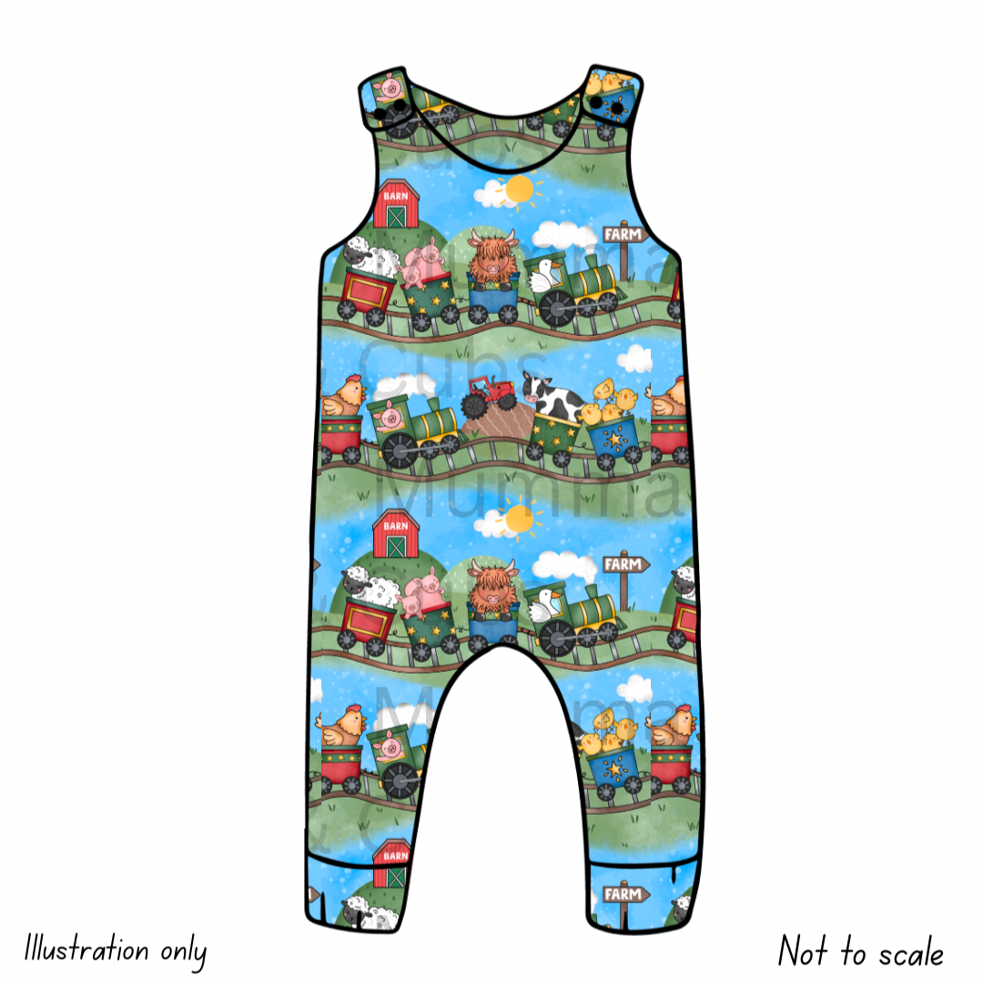 Children's romper with train and farm animal pattern on a blue background