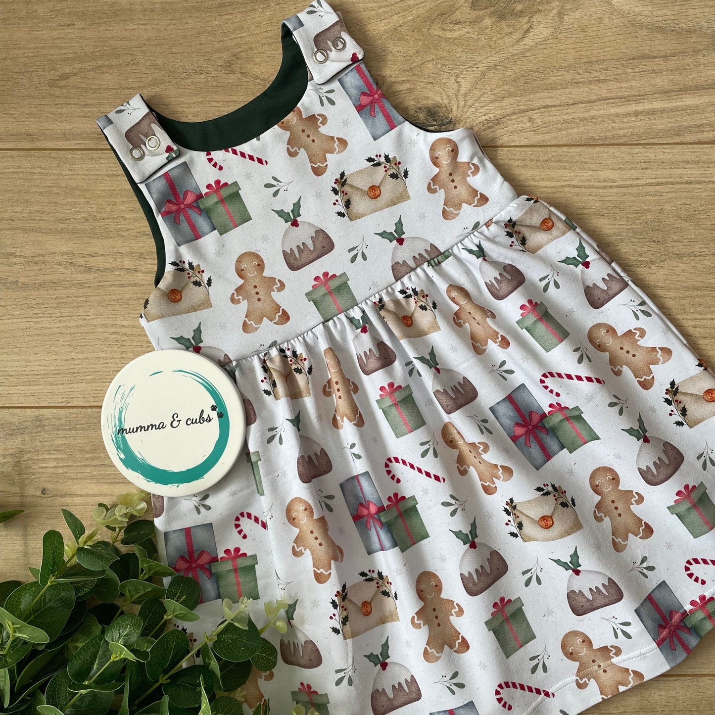 Festive Dress with Christmas-themed design on a wooden surface