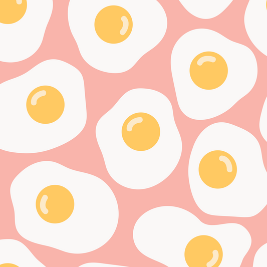 Pattern of fried eggs with yellow yolks on a pale pink background