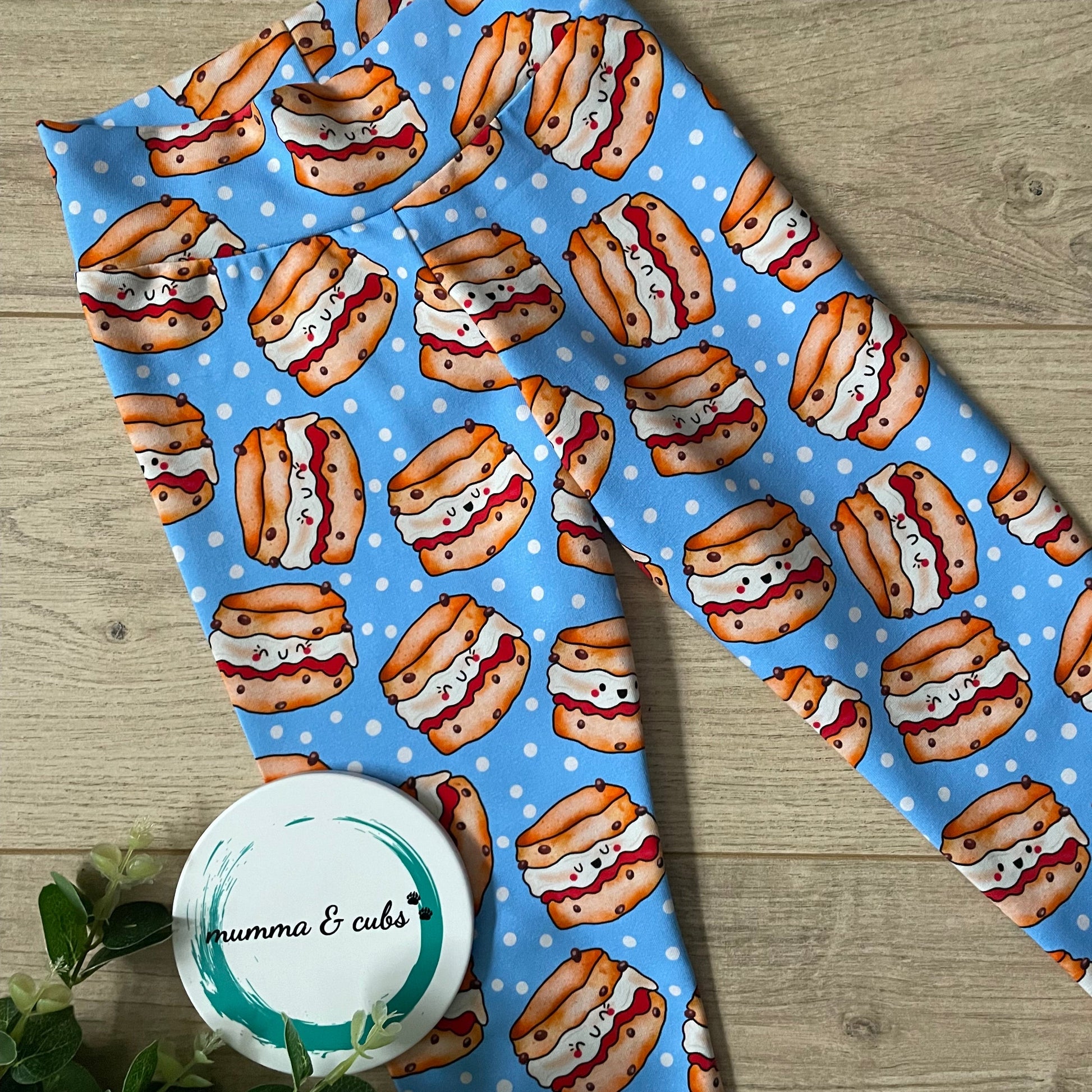 Blue fabric with scones pattern on a wooden surface