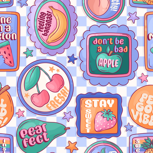 Colorful fruit-themed stickers with text on a checkered background